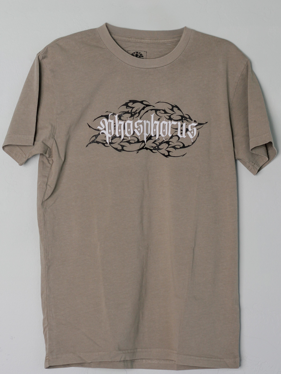 Sandstone shirt with 'Ember Tee' logo on a black tribal background.